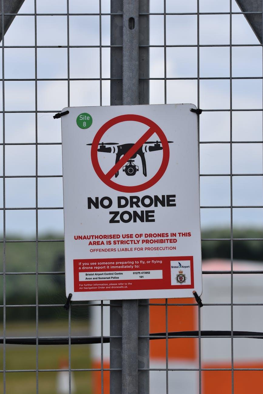 no drone zone signage on the fence